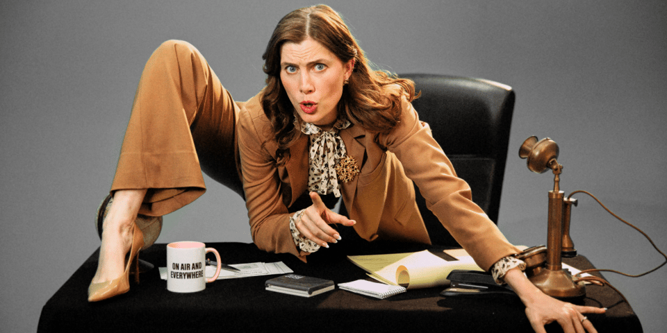 Vic Michaelis crouches over a desk.