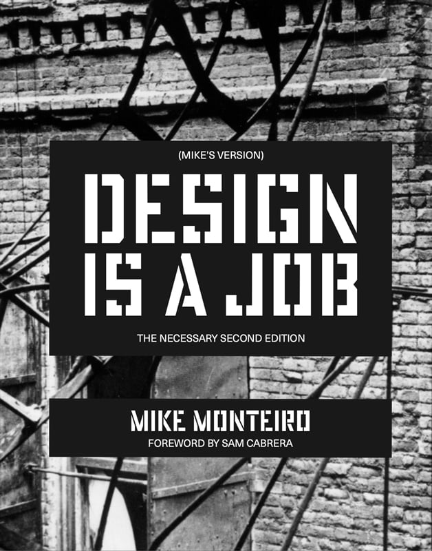 This is the cover of the zine. It says (MIKE'S VERSION) DESIGN IS A JOB, THE NECESSARY SECOND EDITION. Written by Mike Monteiro, Foreword by Sam Cabrera. There's a photo in the background of the molten fire escape from the Triangle Shirt Waist Company fire.