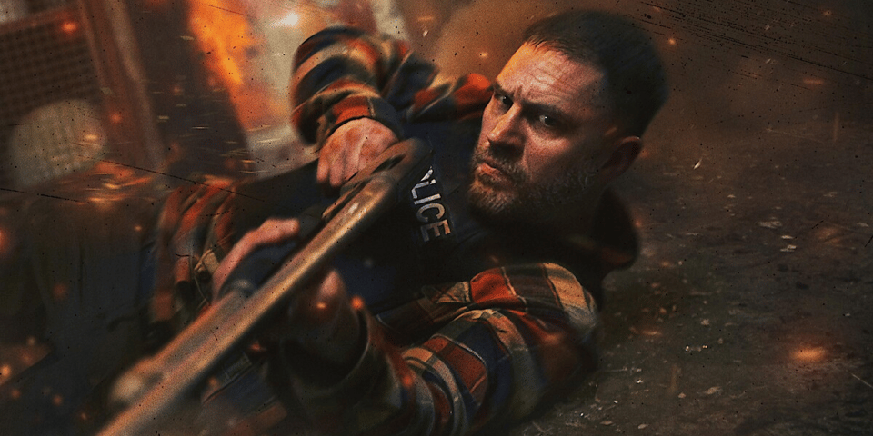 Tom Hardy with a shotgun.