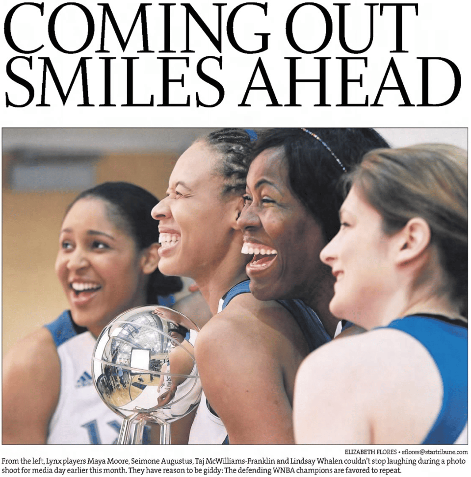 Clipping from The Star Tribune with Maya Moore, Seimone Augustus, Taj McWilliams-Franklin, and Lindsay Whalen smiling with the WNBA championship trophy