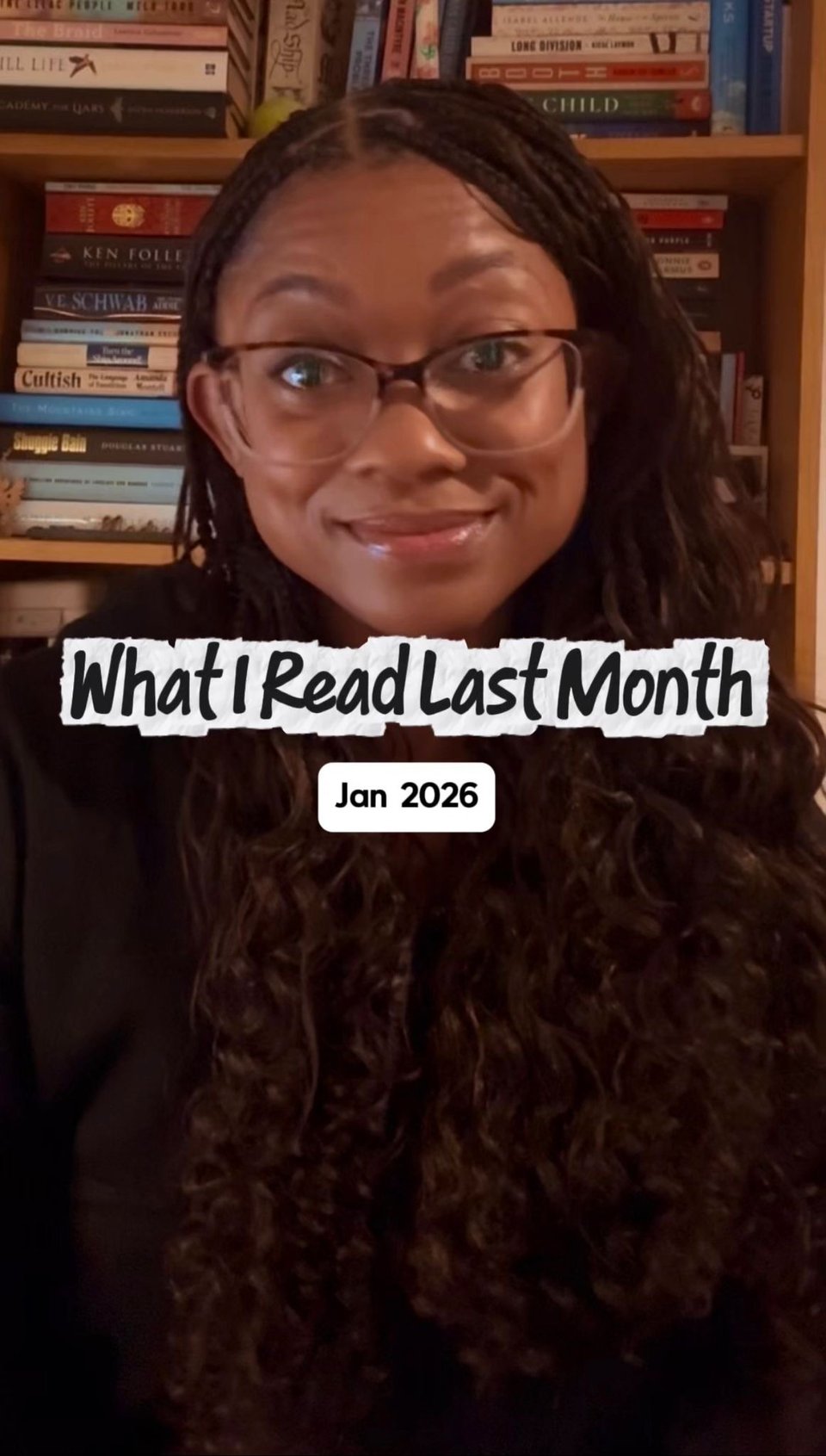 I’m sitting in front of a bookshelf filled with books, wearing glasses and a dark top. I’m looking at the camera with a slight smile. Overlaid text reads: “What I Read Last Month,” with “Jan 2026” below it in a small white label.