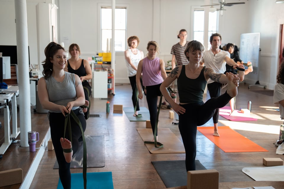 People doing harder-looking yoga.