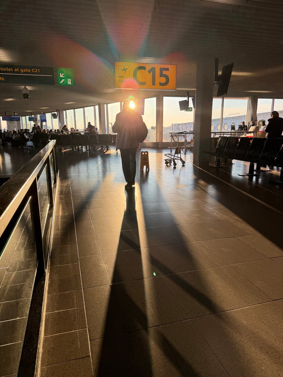 Weak winter morning light casts long shadows in the Schiphol airport.