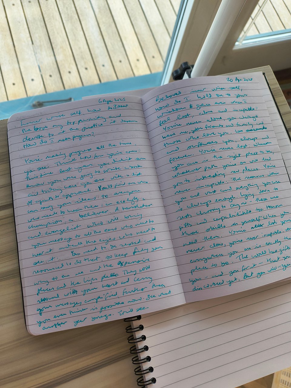 A picture of a small journal on top of a desk.