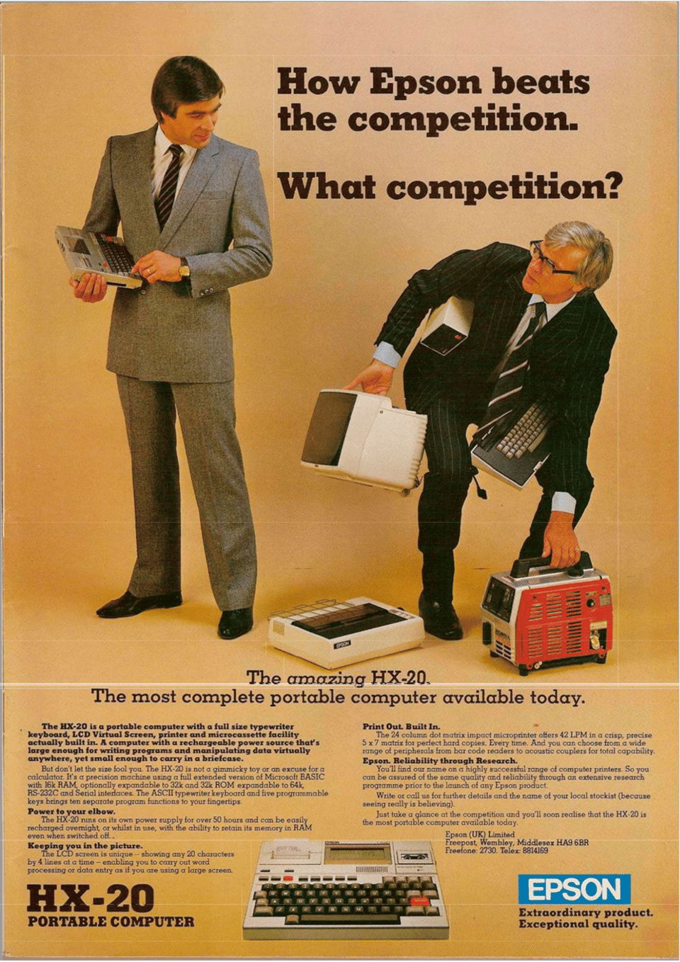 A photo of two men. The man on the left is holding a small computer the size of a file folder. The man on the right is bent over trying to pick up a printer, monitor, computer, backup power supply, and keyboard.