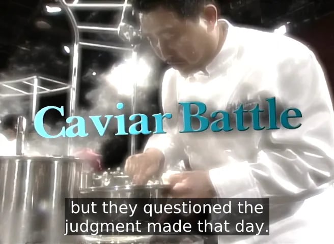Screenshot from early-2000s Iron Chef, with glossy lighting and "Caviar Battle" in Word Art style teal lettering