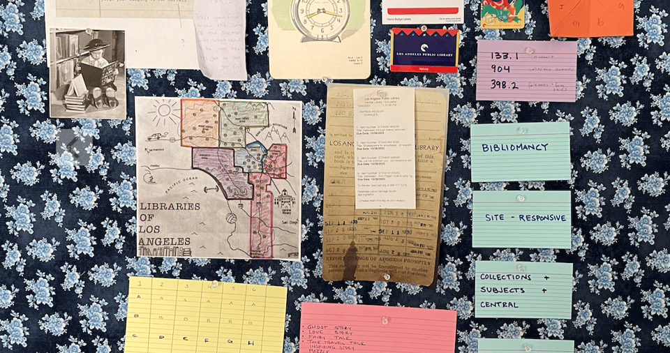A fabric-covered bulletin board showing inspiration photos and images for a project about bibliomancy