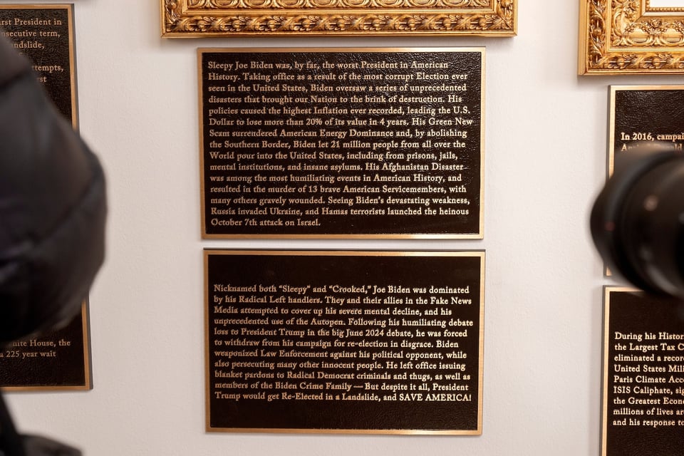 President Donald Trump has installed plaques underneath the portraits of presidents in the Rose Garden colonnade that detail aspects of their presidencies, in Washington, Dec. 17, 2025.
