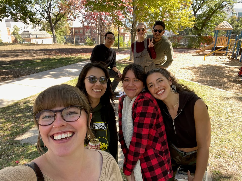 A group selfie at a park.