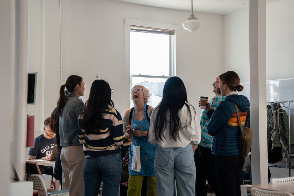 Beth talking to a group of friends.