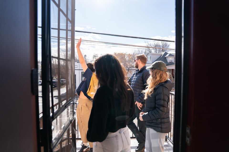 A group standing outside the door.