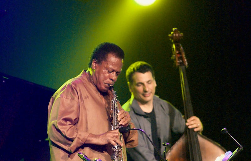Wayne Shorter playing the saxophone at a concert