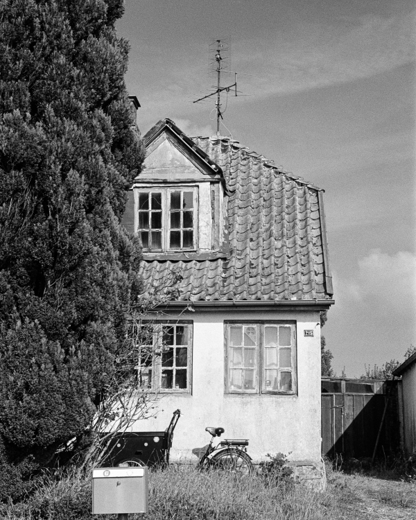 a house with a bicycle in front of it