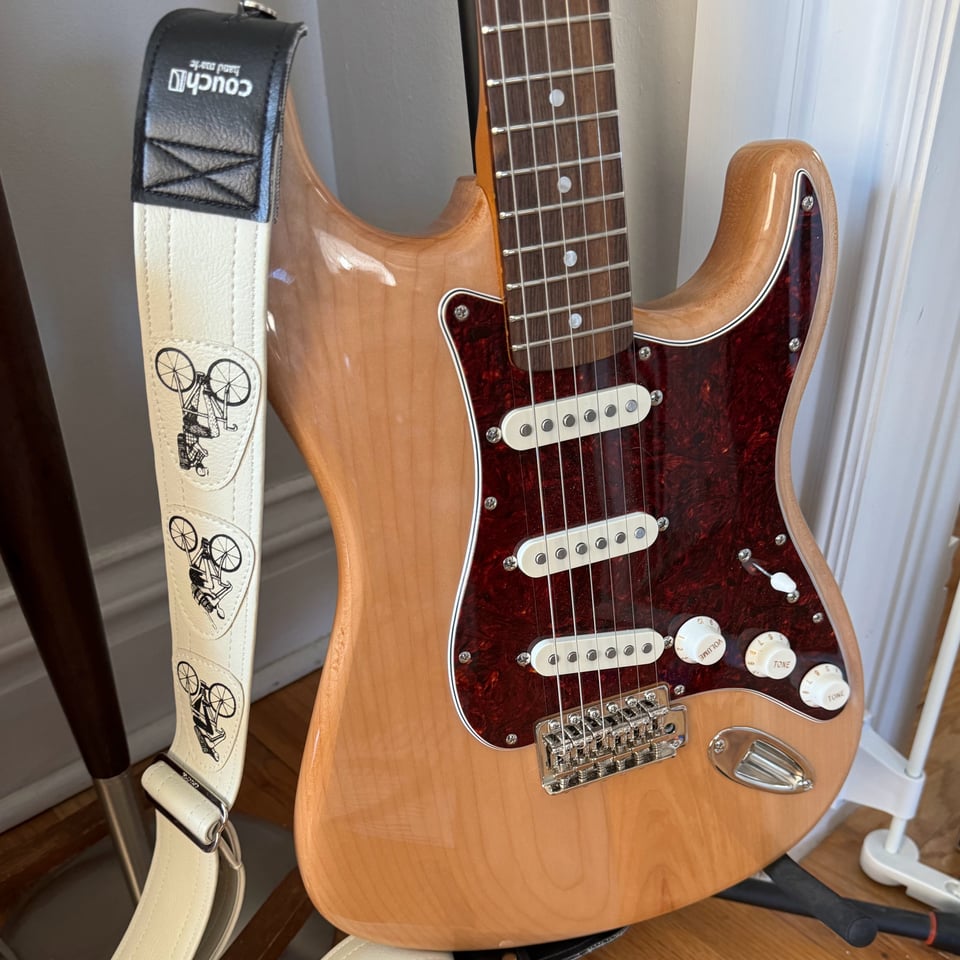 a guitar with a strap