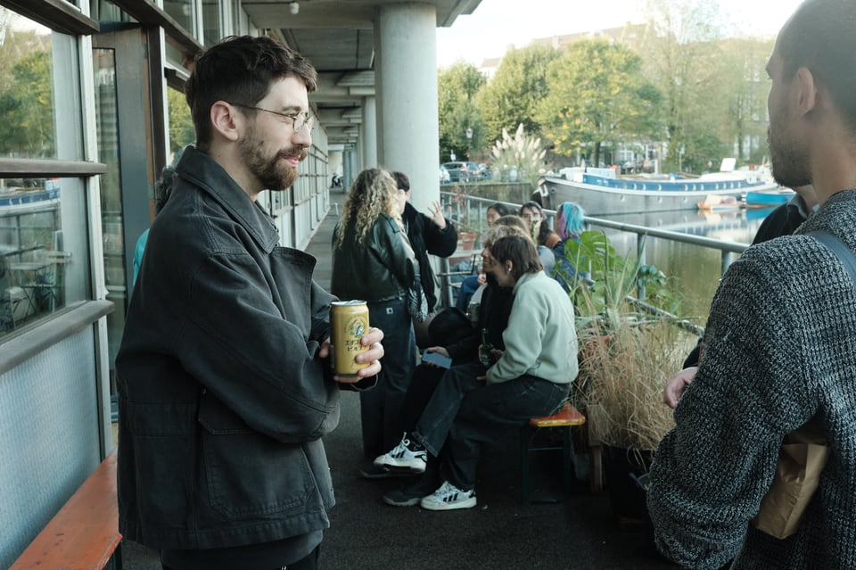 People hanging out canal-side