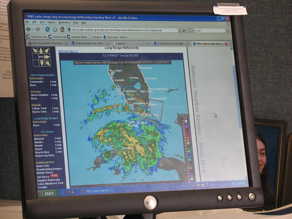 A computer screen with a weather map on it.  Image credit: fly01007 via NOAA Photo Library.