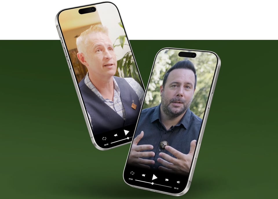 Two smartphones with video clips appear in the center of a dark green background, with a man in a vest with blonde hair in one, and a man in a dark shirt and dark hair in the other.
