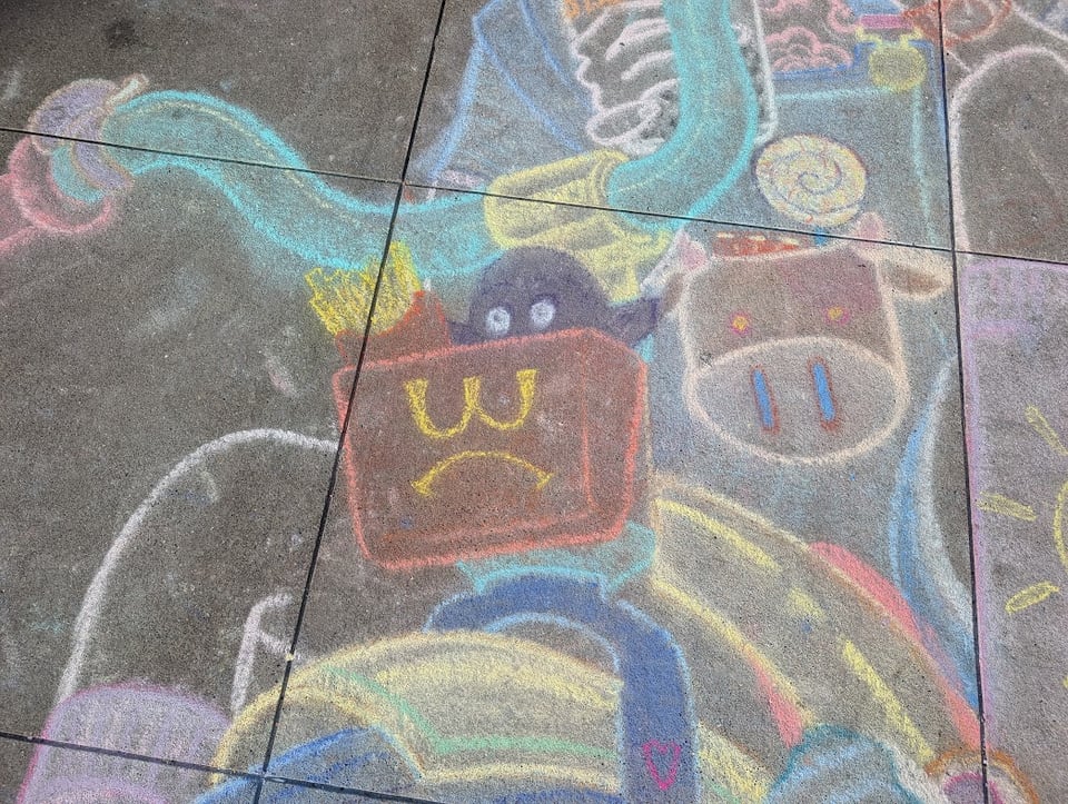 A purple guy who loks kind of like the Grimace sitting in a box with the McDonalds logo upside down, surrounded by weird cartoon shapes and tubes