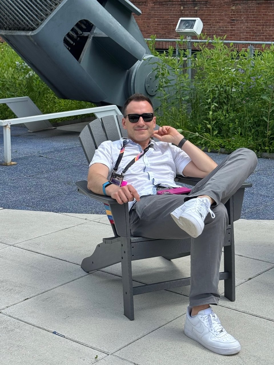 Me in a grey chair on the beautiful conference terrace.