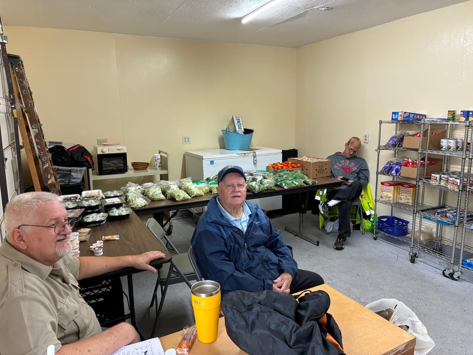 People and some produce in our newly renovated pantry building.