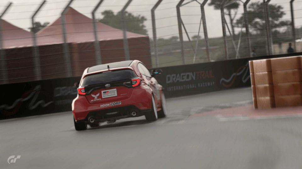 Toyota Corolla racing at Dragon Trail in Gran Turismo 7