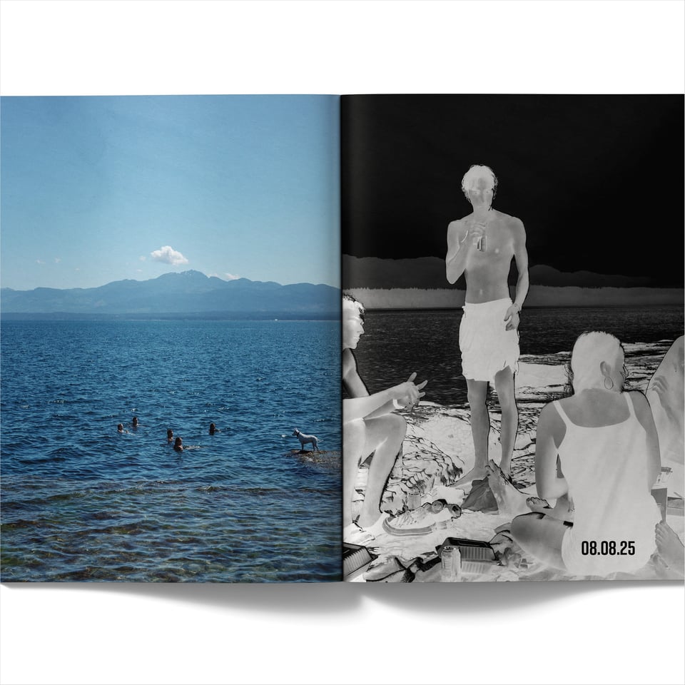 Two-page spread. Left page: a colour photograph of people swimming in a deep blue body of water with a rocky shoreline in the foreground and mountains in the distance under a clear sky. Right page: an inverted black-and-white negative image of three people sitting and standing on rocky ground near the water, one holding a drink. In the bottom-right corner, the date “08.08.25” is printed in black.
