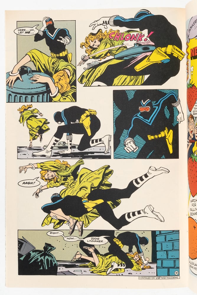 a page from Vigilante. He is fighting a woman in an alley