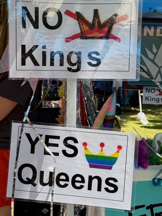 Sign at Santa Fe Pride Parade that says No Kings Yes Queens.