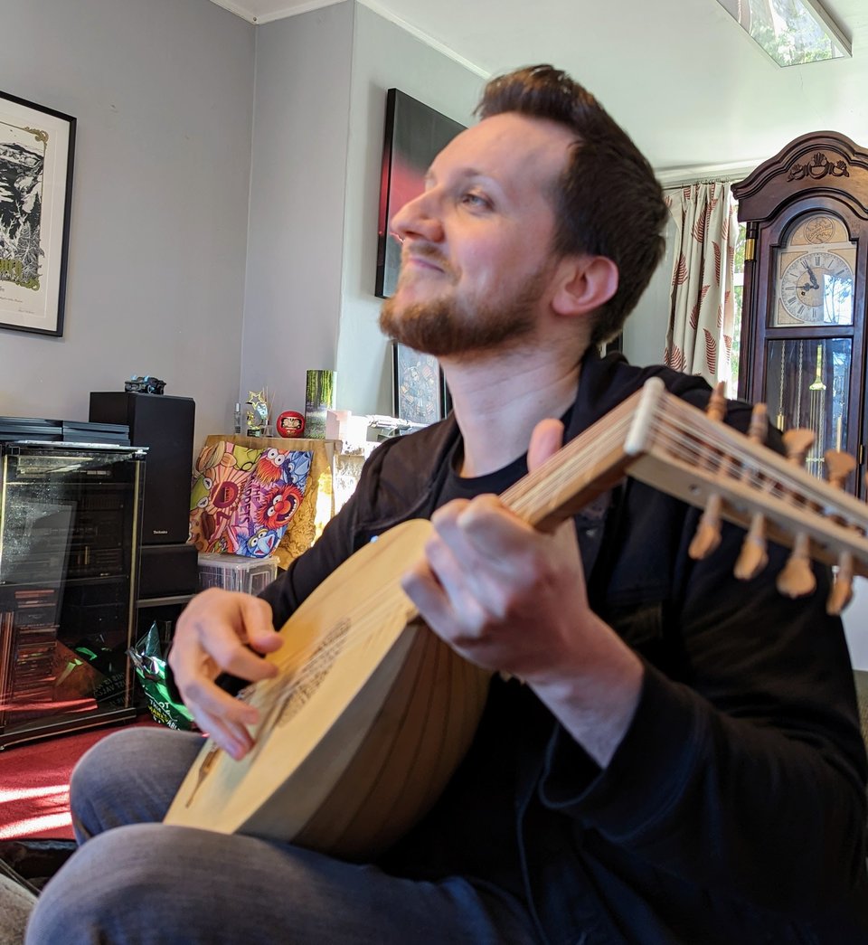 Chris with his new lute, looking wistfully off-camera.