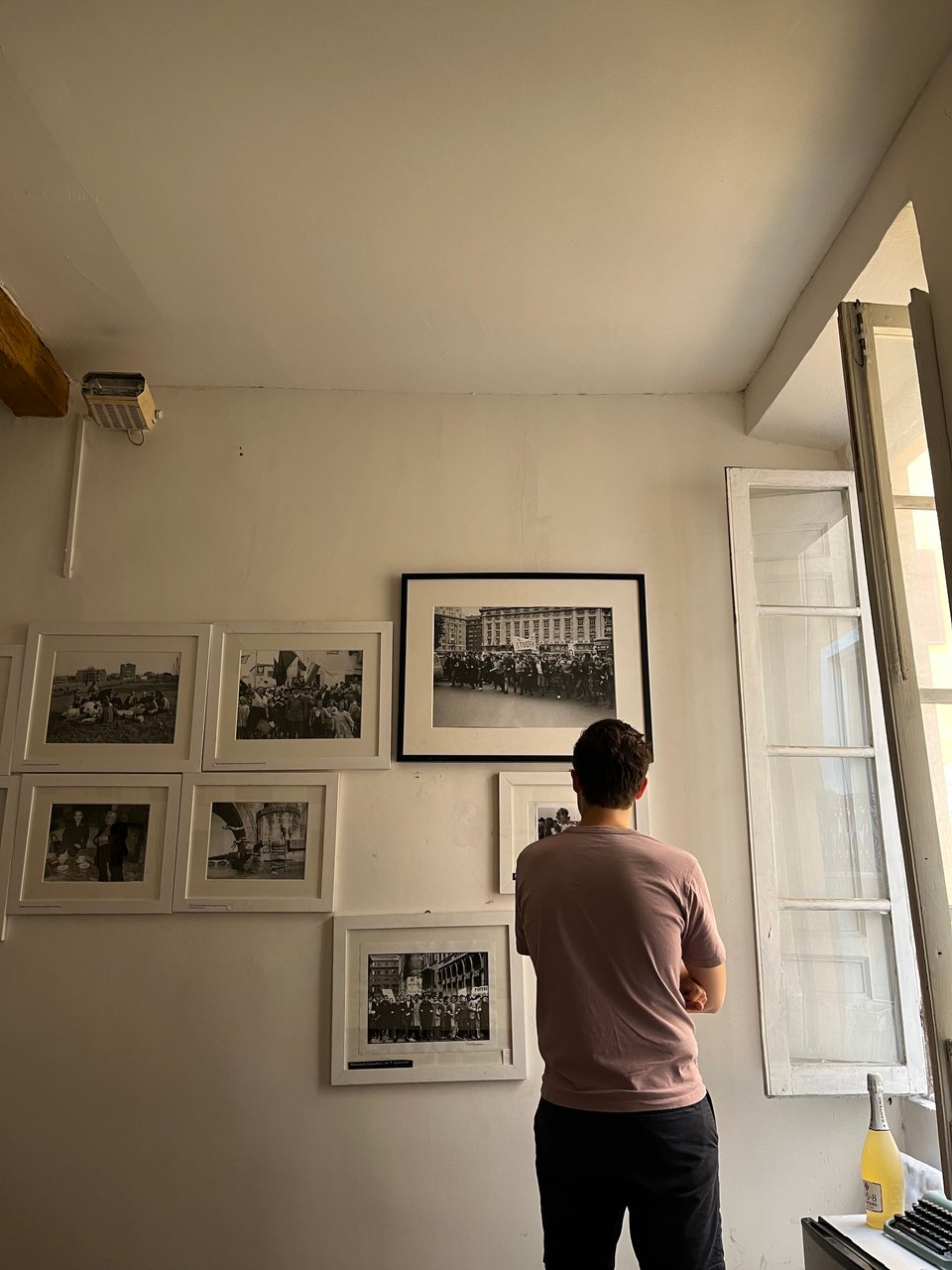 c. looking at photographs in a store in rome