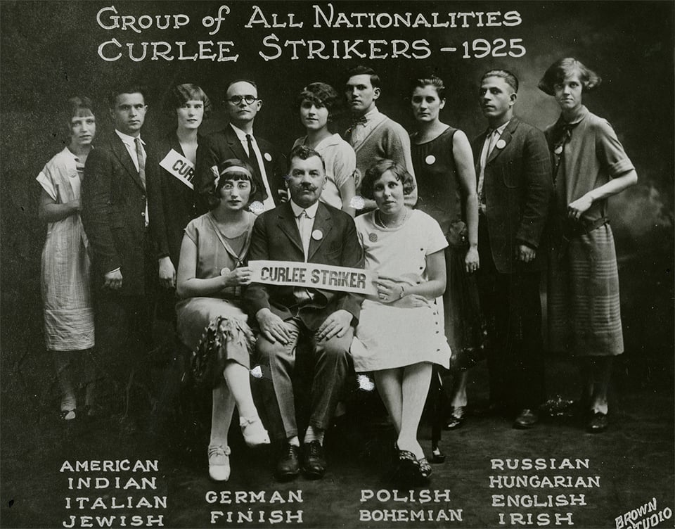A photo of the Curlee Strikers a group of immigrant clothing workers where people of all types gather to strike for rights.