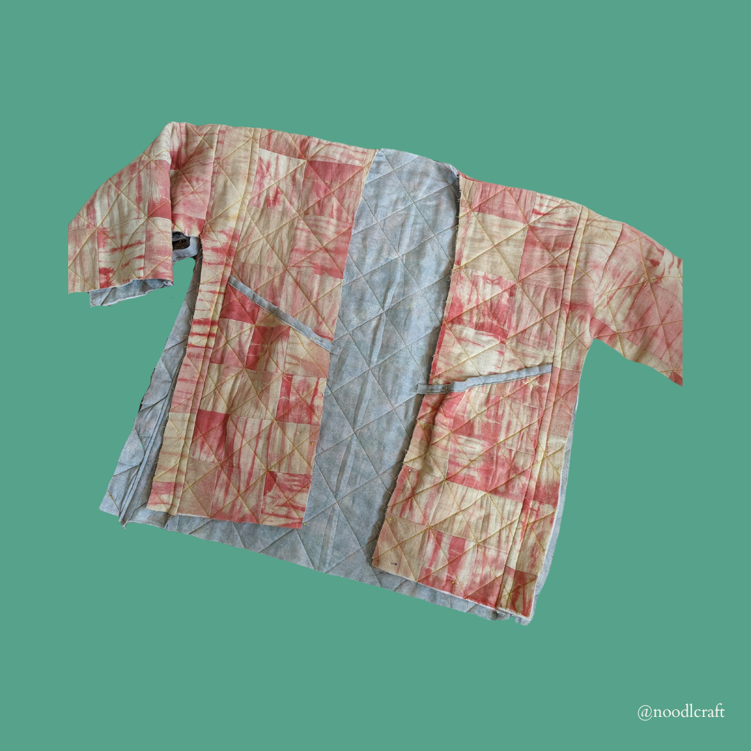 A picture of the quilted jacket coming into shape, with just the side seams open.