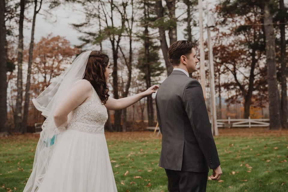 a bride and groom doing a first look