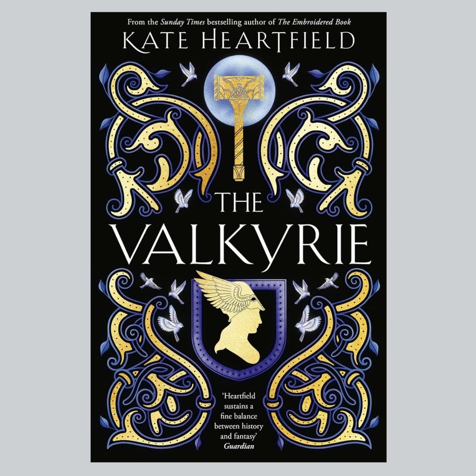 A black book cover with gold and purple Norse details. The title is The Valkyrie and the author is Kate Heartfield.