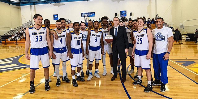 a basketball team posing for a picture