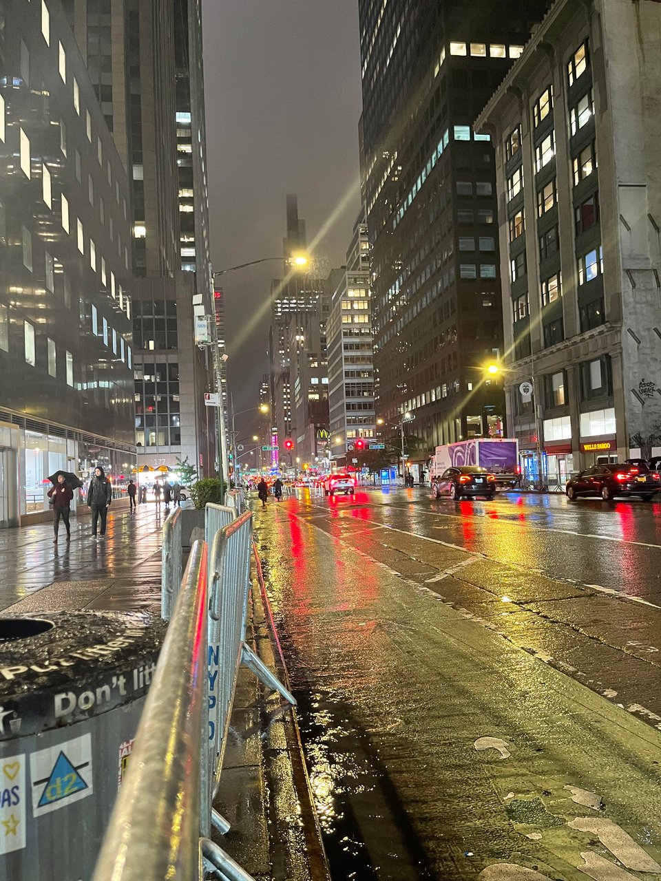 A wet street in NYC at night