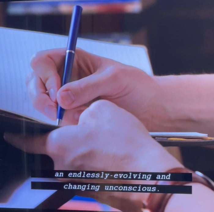a person writing in a notebook