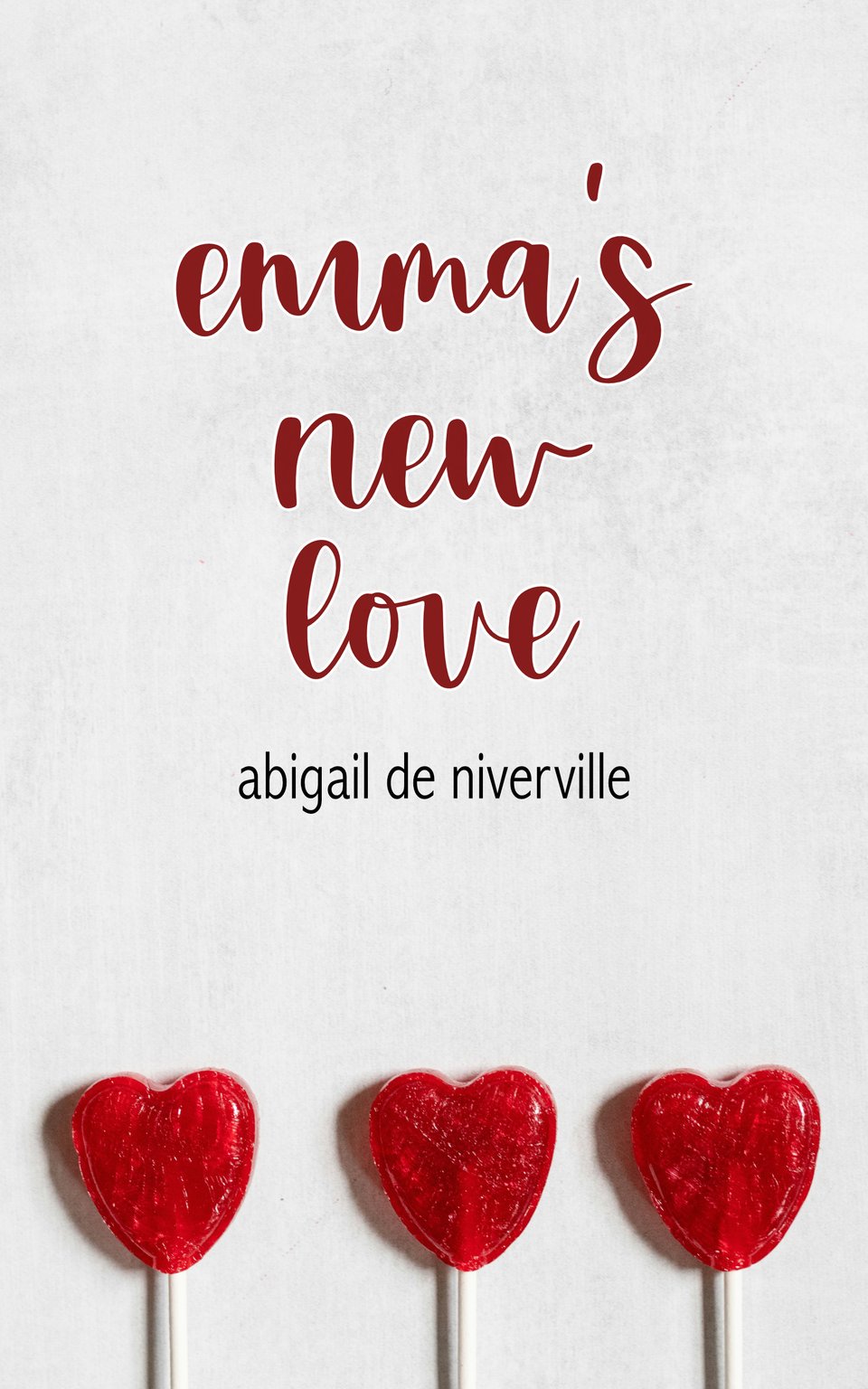 The cover of Emma's New Love by Abigail de Niverville. The cover image is a white background with heart-shaped red suckers on the bottom. The title is written in lowercase cursive and the author name is written in lowercase sans serif.