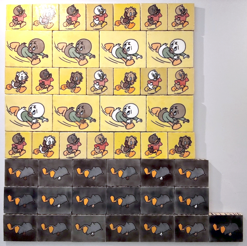 A painting of running children (except they're ducks). The three bottom rows is 19 dead children covered by sheets, or blankets, with their feet sticking out.