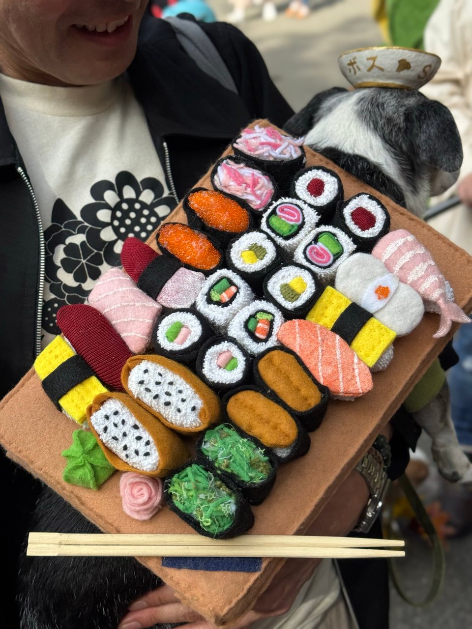 A close-up of the sushi platter, revealing that it is covered with intricate beading.