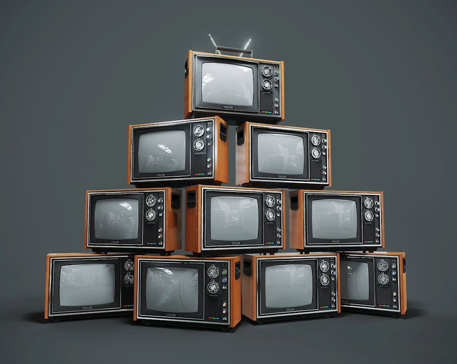 A pyramid made of old style wooden TVs