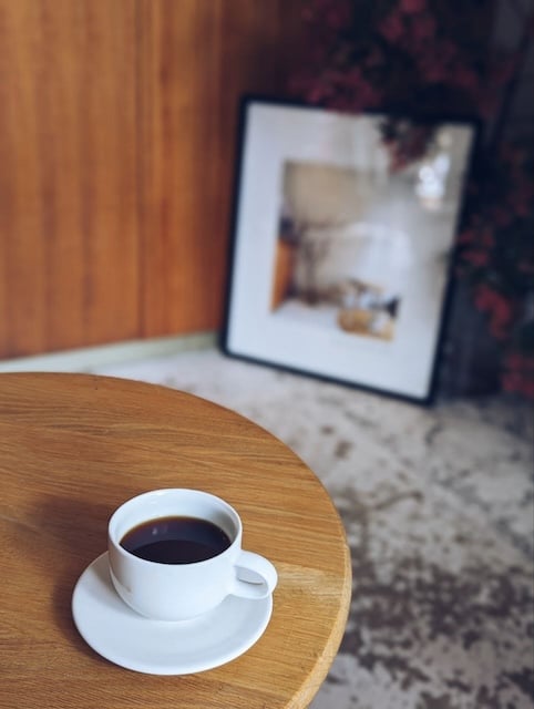 black coffee in a cup on a table