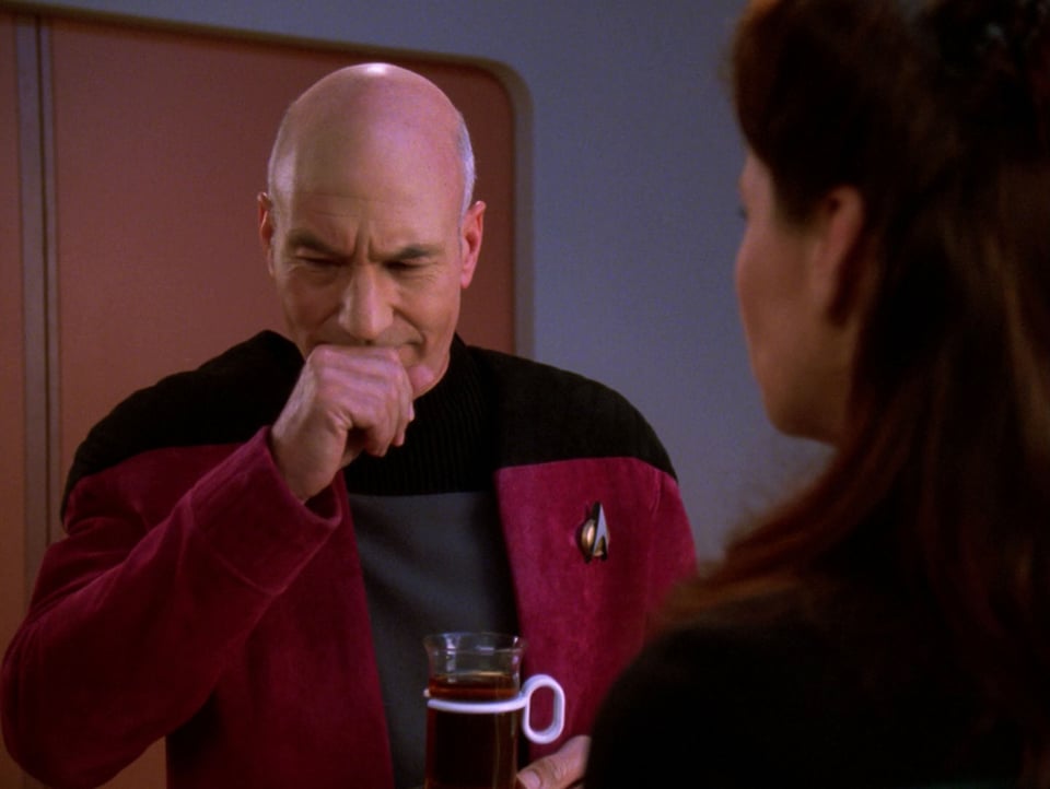 Captain Picard coughs after sampling Commander Darren's herbal tea blend.