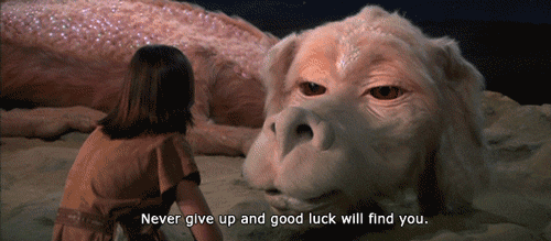gif from never ending story saying never give up and good luck will find you