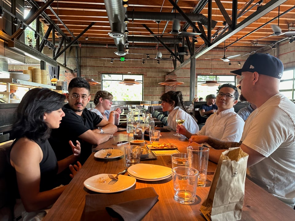 A group of people at a restaurant.