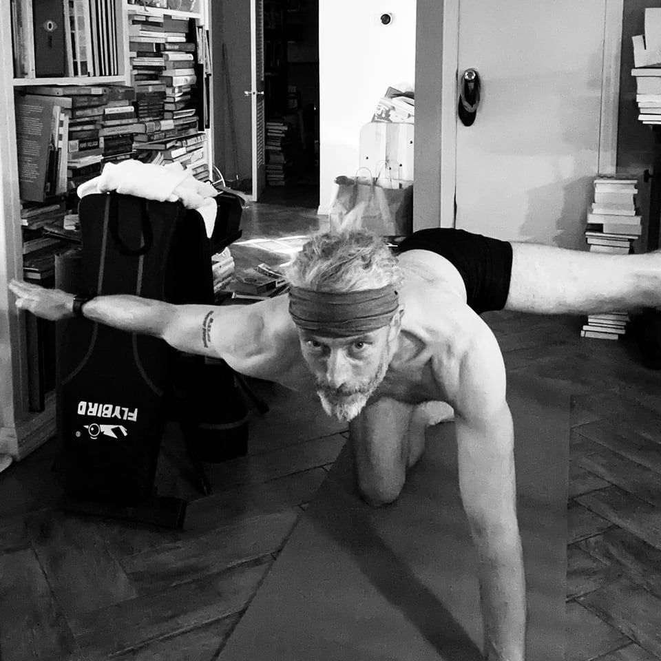 b/w photo of white man in Balancing Table yoga pose