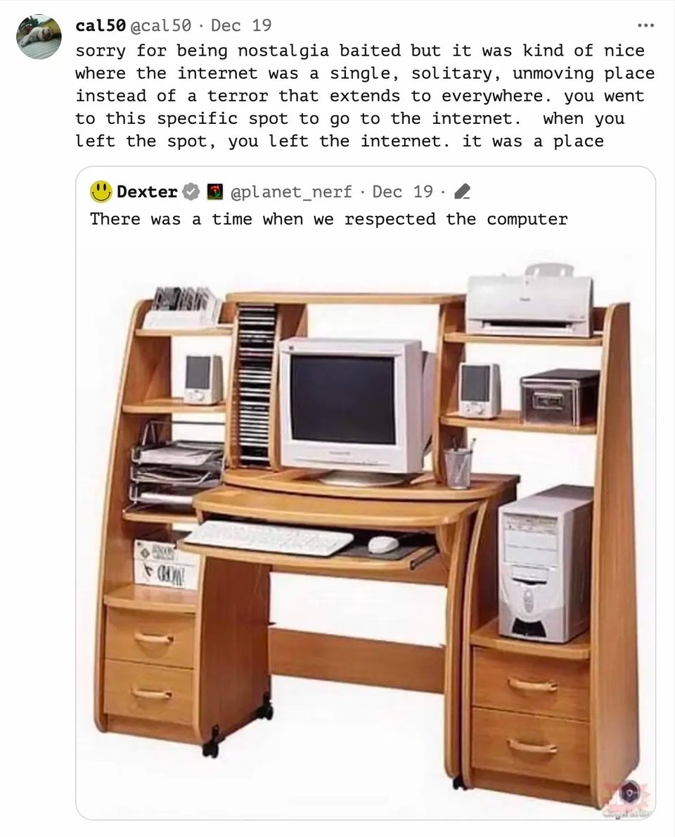 image of an old computer desktop, monitor, and brown wooden computer desk