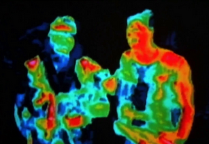 An image from the movie "Predator", showing humans being observed by the titular alien game hunter through its thermal vision.