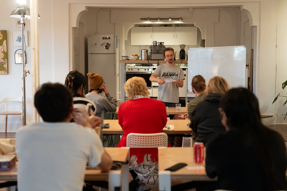 Elijah teaching a knife sharpening workshop.