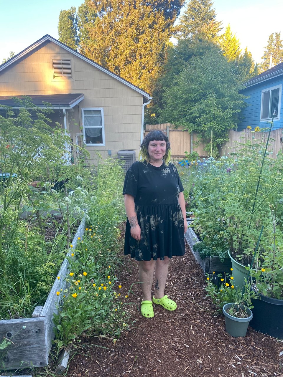 elliott standing in their garden.